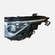 Physical IQ.LIGHT detail on photographed target-configuration headlight for Volkswagen Golf 8 2020-2023; confirm actual supplied markings